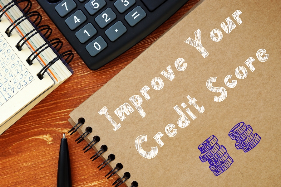 Business concept about Improve Your Credit Score with inscription on the sheet.